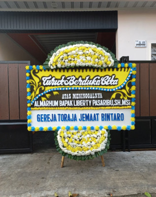 Papan Bunga Duka di Yigi